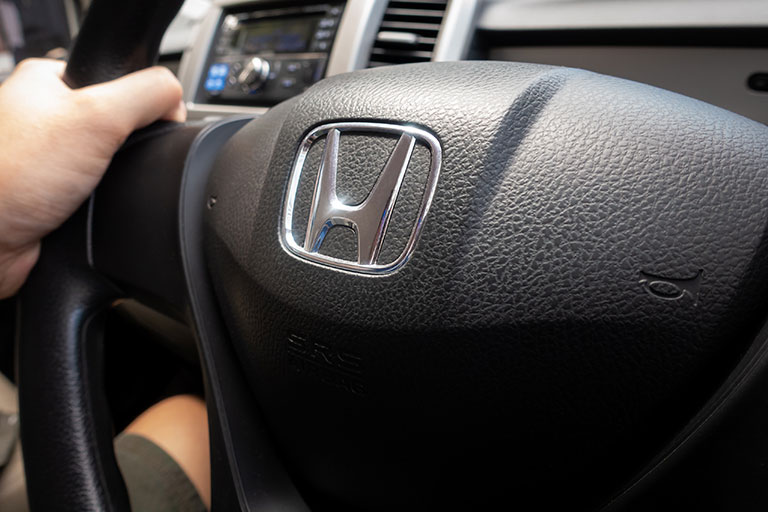 Honda logo visible on a steering wheel