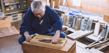 A master blacksmith places on of his sushi knives into a presentation box