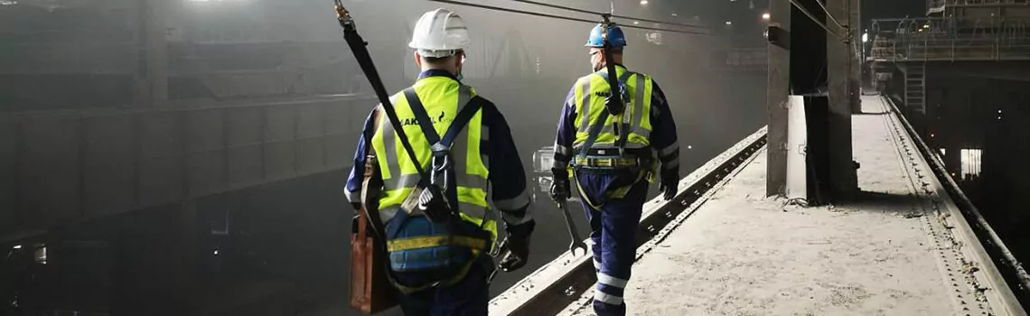 Two steel workers in a steel plant