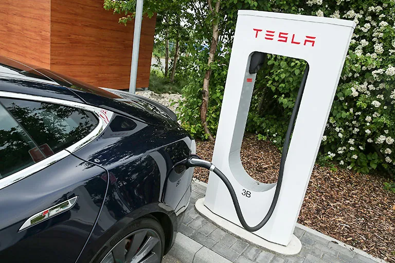 Tesla car at a charging station Tesla car at a charging station