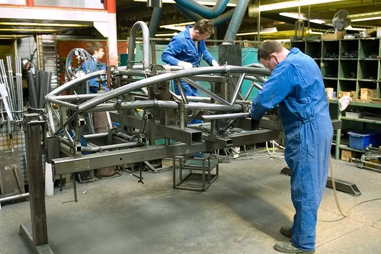 Workers constructing a Nomad chassis at the Arch Motor and Manufacturing workshop Workers constructing a Nomad chassis at the Arch Motor and Manufacturing workshop